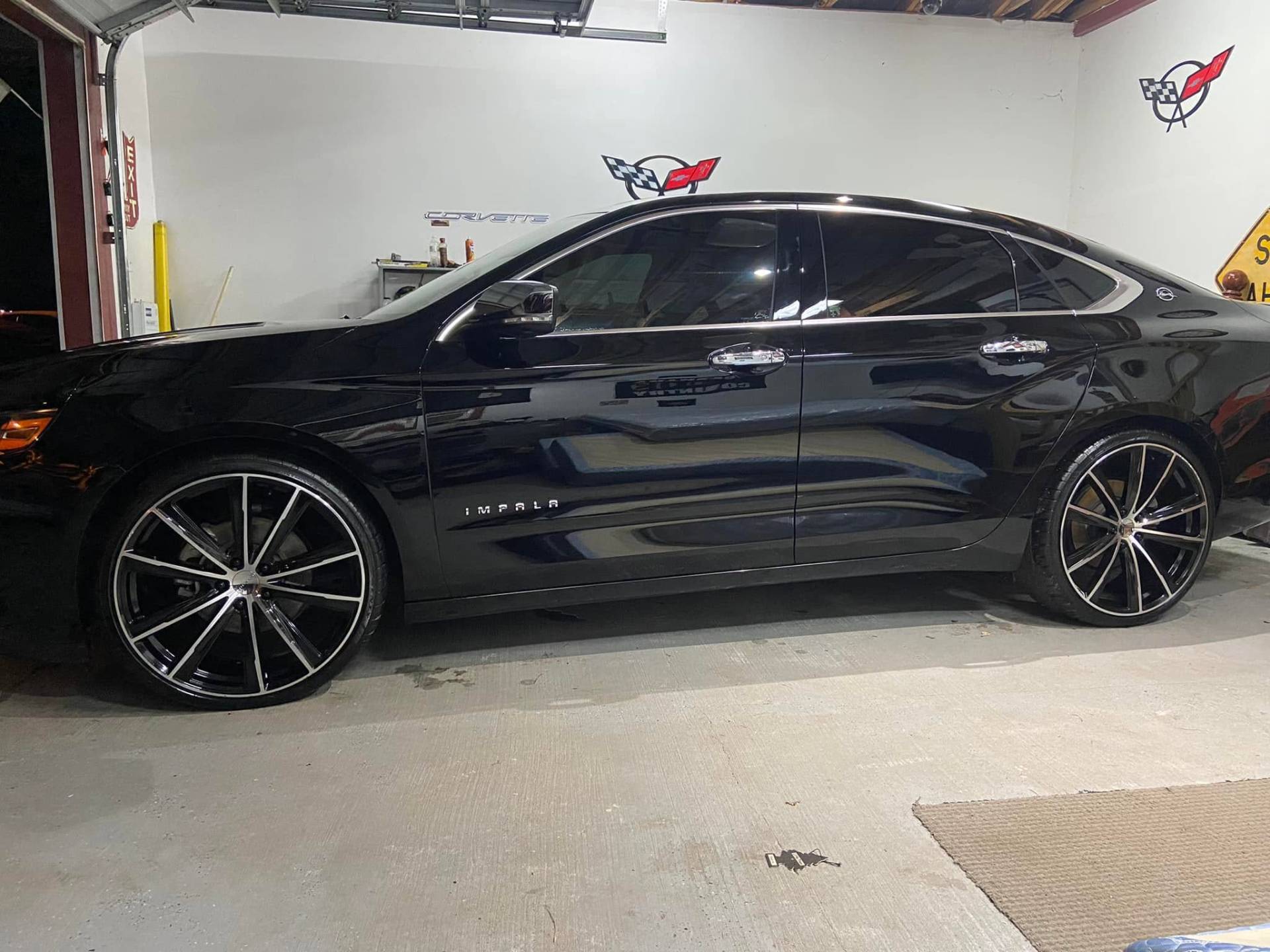 Black Chevy Impala on custom wheels detailed